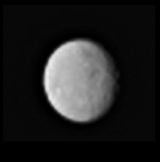 A zoomed-in view of the dwarf planet Ceres, seen from a distance of 238,000 miles (383,000 kilometers) by the Dawn spacecraft on Jan. 13, 2015. The image hints at the presence of craters and other features on Ceres' surface. 