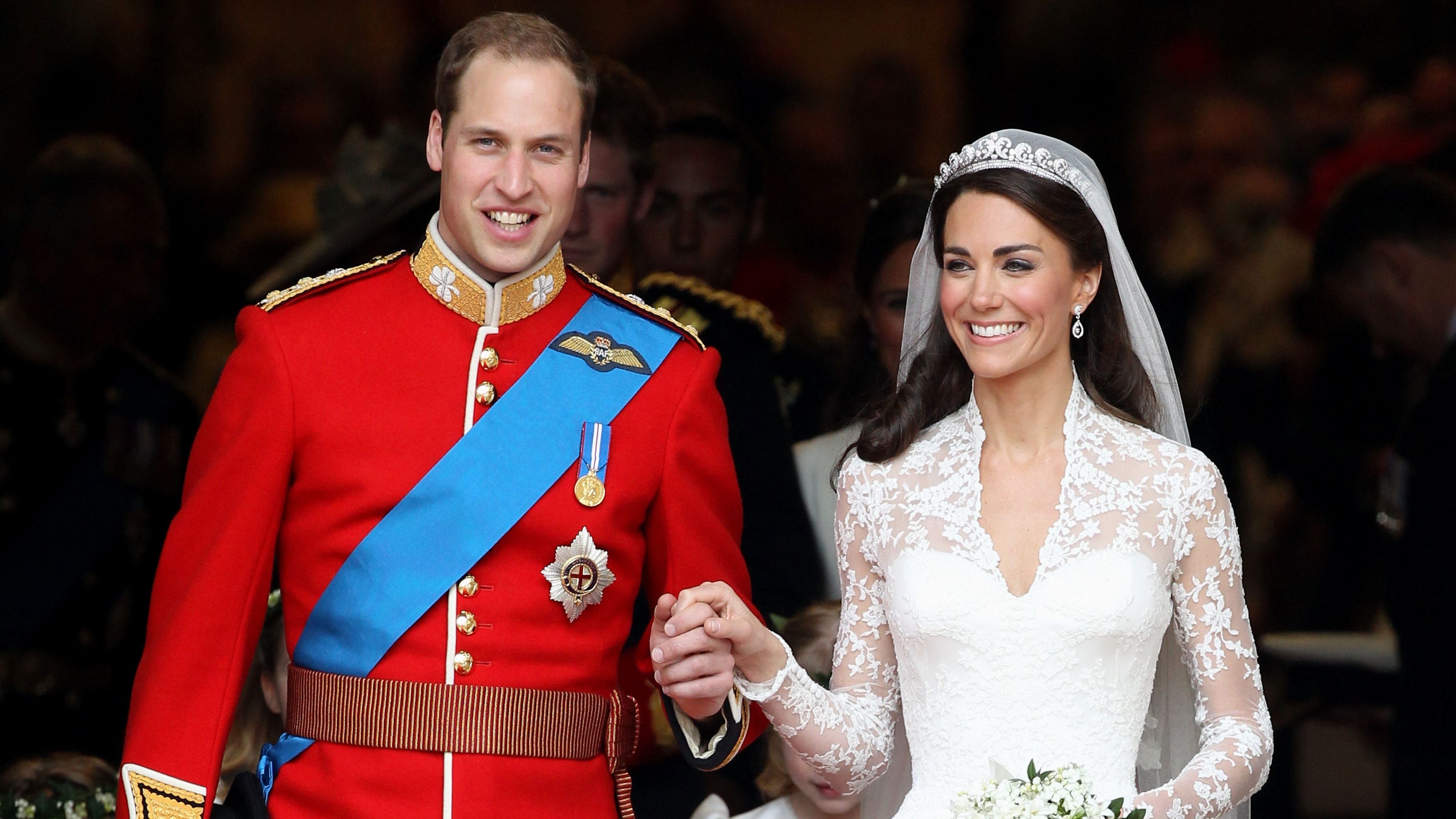Prince William and Catherine, Princess of Wales smile following their marriage at Westminster Abbey on April 29, 2011 in London