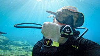 a photo of writer Torben Lonne wearing the Apple Watch Ultra on a dive
