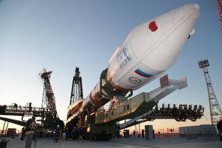 The Soyuz rocket carrying the Bion-M1 space capsule, an animals in space experiment, is raised into launch position at Baikonur Cosmodrome pad in Kazakhstan.