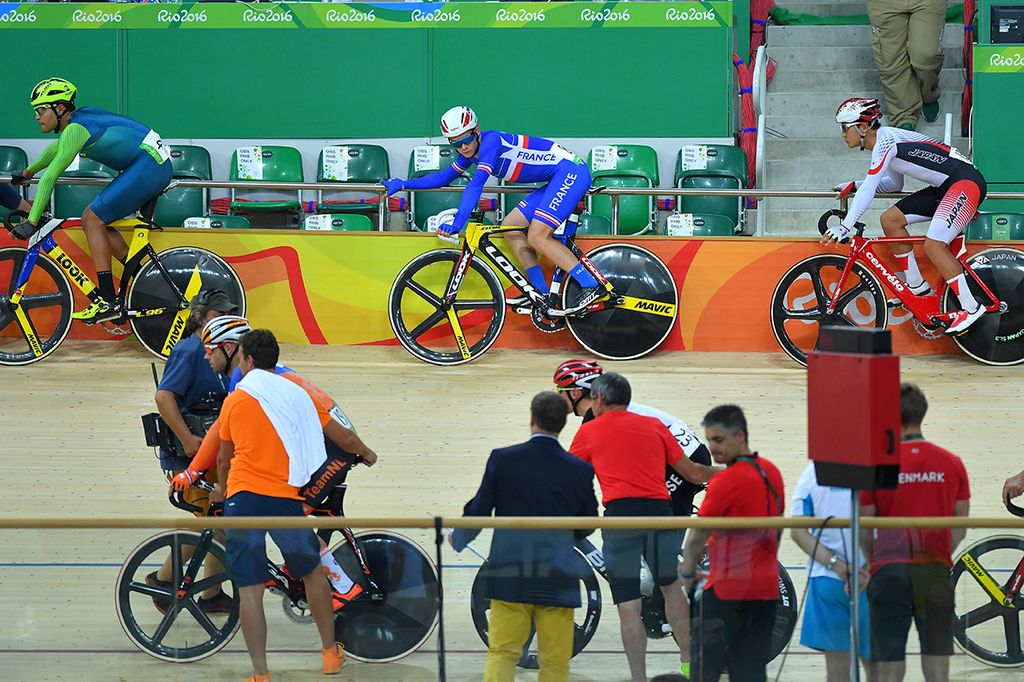 Thomas Boudat (France) holds the hoarding before the elimination race gets underway