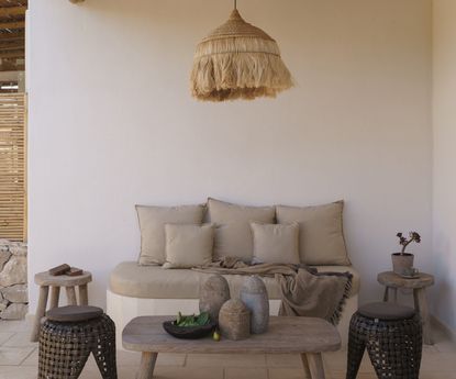 minimalist outdoor furniture on a shaded patio