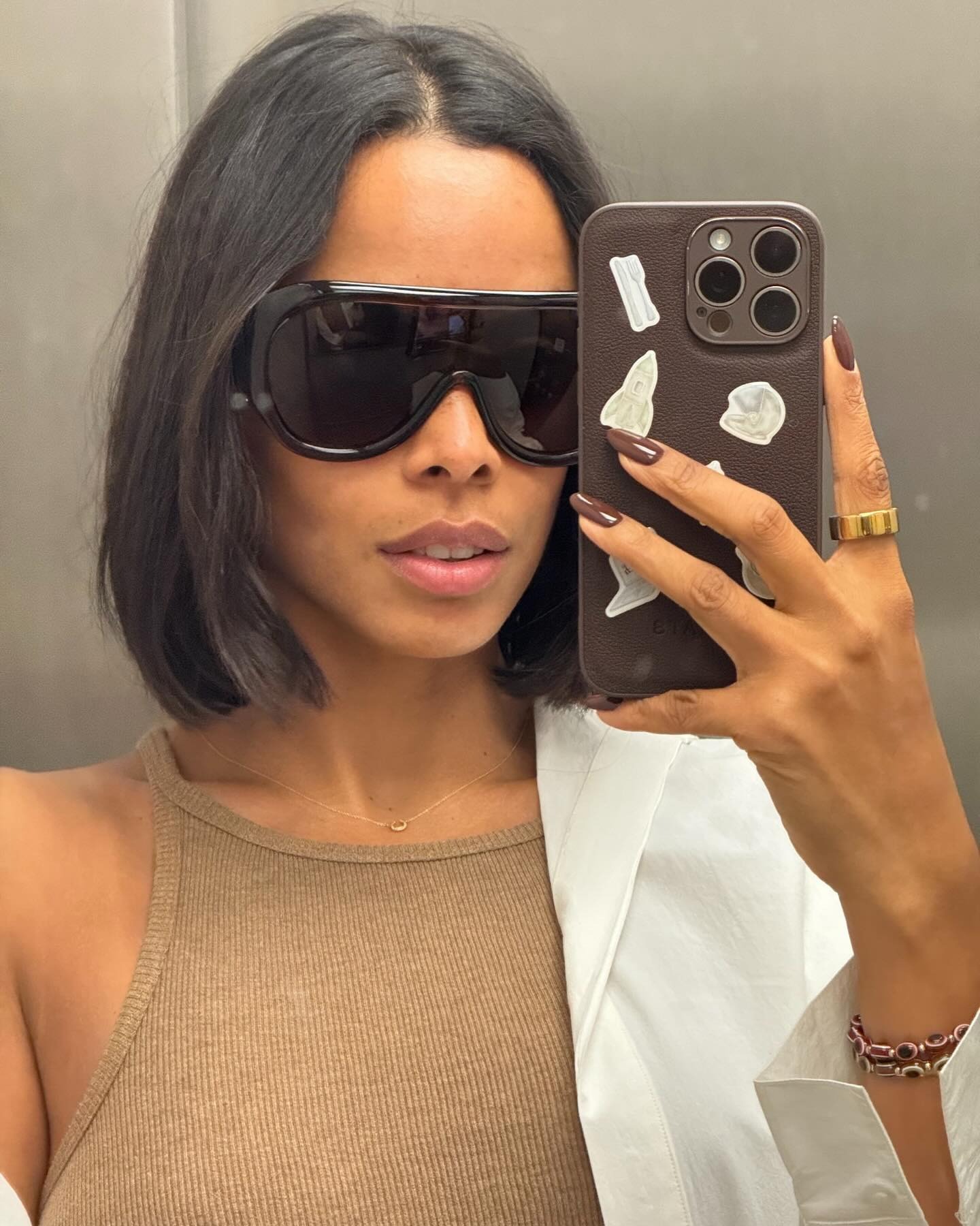 Rochelle Humes taking a mirror selfie with a sleek bob hairstyle