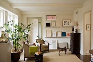 Living room with prints arranged on shelves