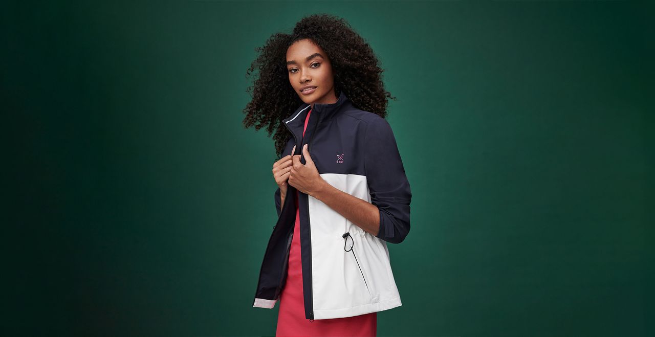 Model pictured wearing the Crew Clothing Golf Showerproof Jacket