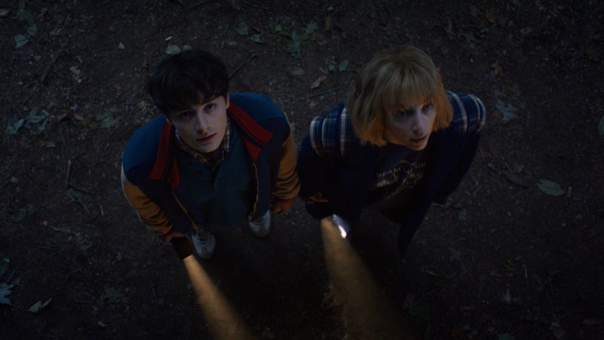 L-R: Will Byers (Noah Schnapp) and Robin Buckley (Maya Hawke) explore the Upside Down in a scene from "Stranger Things" season 5