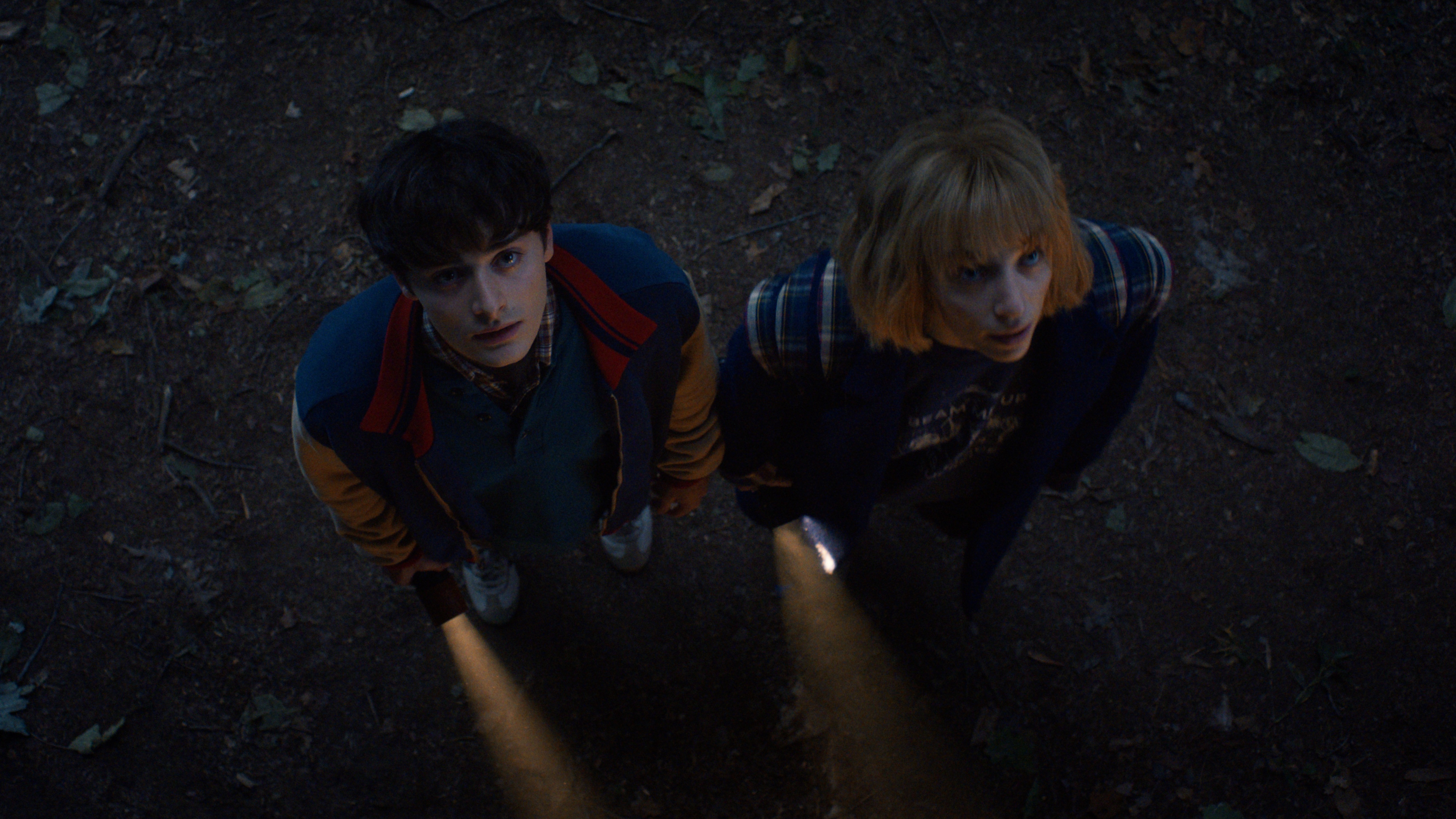 L-R: Will Byers (Noah Schnapp) and Robin Buckley (Maya Hawke) explore the Upside Down in a scene from "Stranger Things" season 5