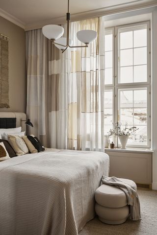 A bedroom layered with beige colors