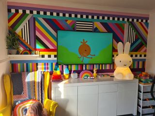 colourful painted living room wall with tv