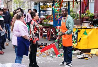 Finlay Baker's food stall is trashed as he speaks to Whitney Dean and Bernie Taylor in the market.
