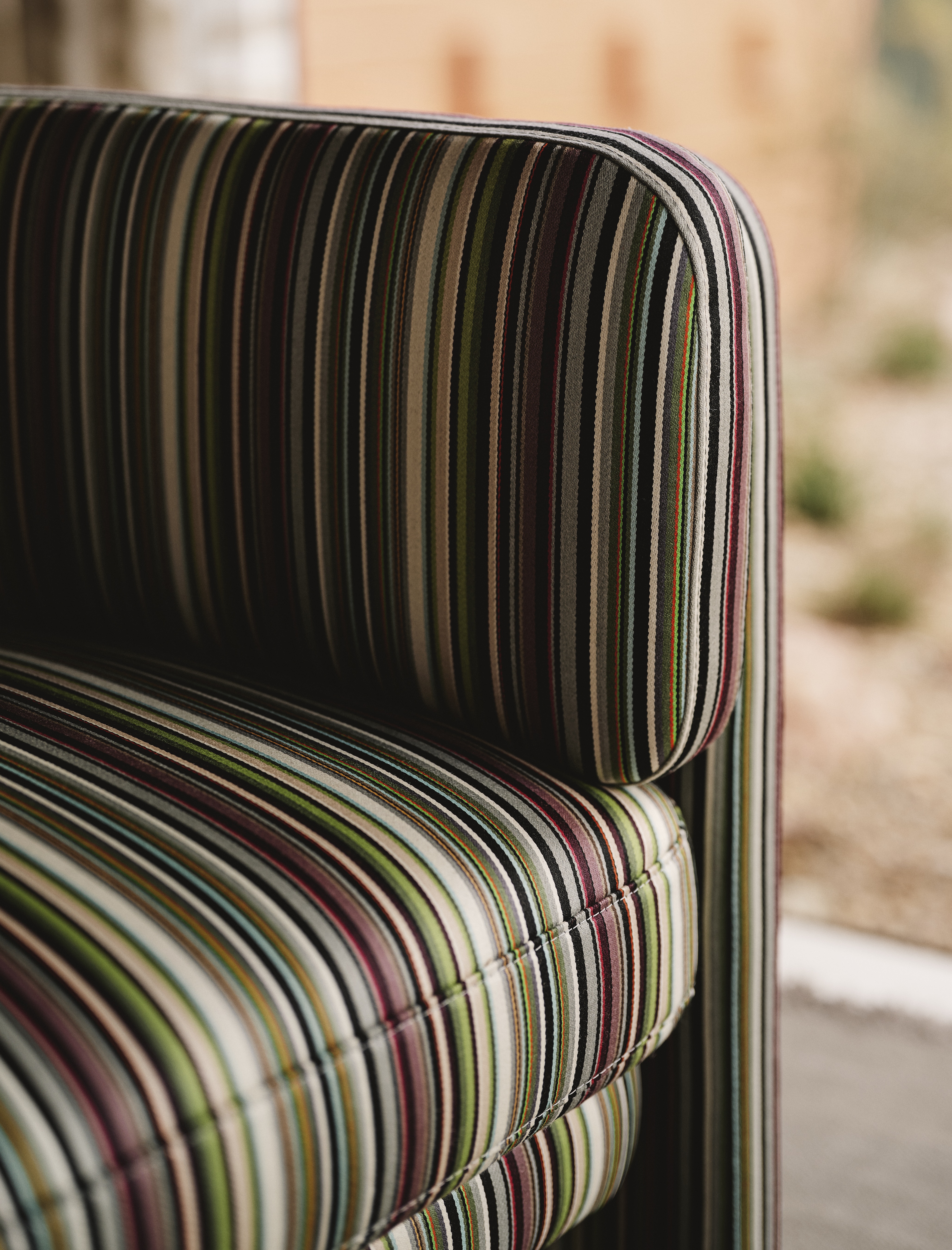 A Californian desert house from the mid 20th-century is furnished with earthy, stripy furnishings and iconic design pieces.