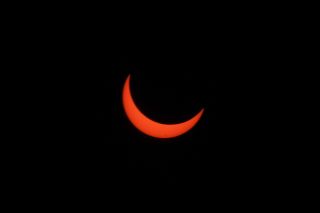 A partially-eclipsed sun shortly before totality.