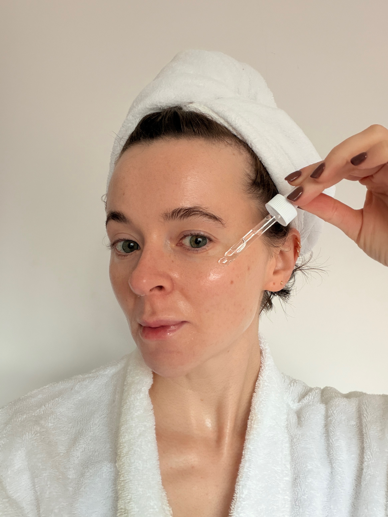 Grace applying a serum from The Ordinary