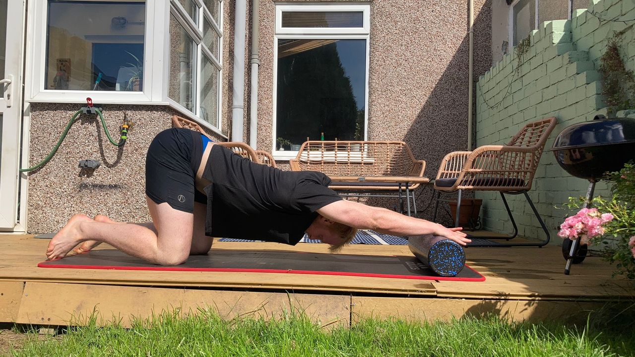 Fit&amp;Well fitness writer Harry Bullmore performing the prayer stretch