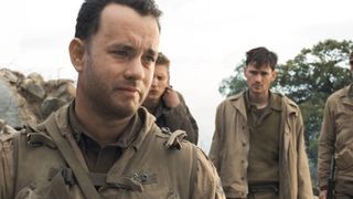 Tom Hanks, as Capt. Miller, stands in a destroyed European town in World War II in Saving Private Ryan