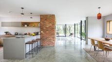 A contemporary open plan home with glass external walls