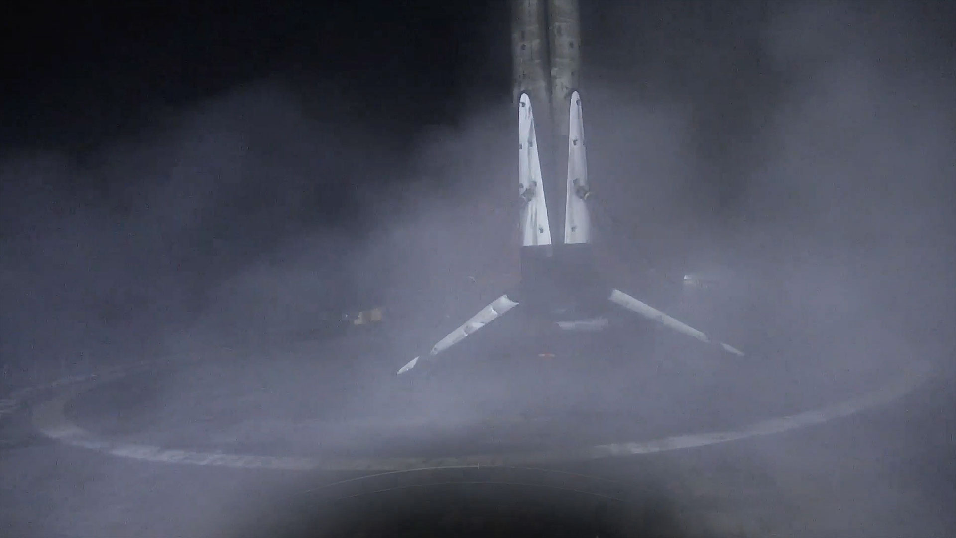 the first stage of a rocket stands on an ocean-based platform following a launch into space