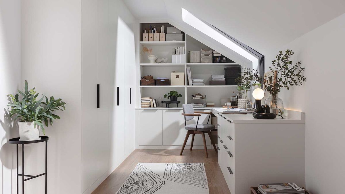 white loft conversion home office with built in storage