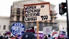 UNITED STATES - APRIL 2: A pro-choice demonstrator holds a sign in front of the U.S. Supreme Court as the Medina v. Planned Parenthood South Atlantic case is heard on Wednesday, April 2, 2025.