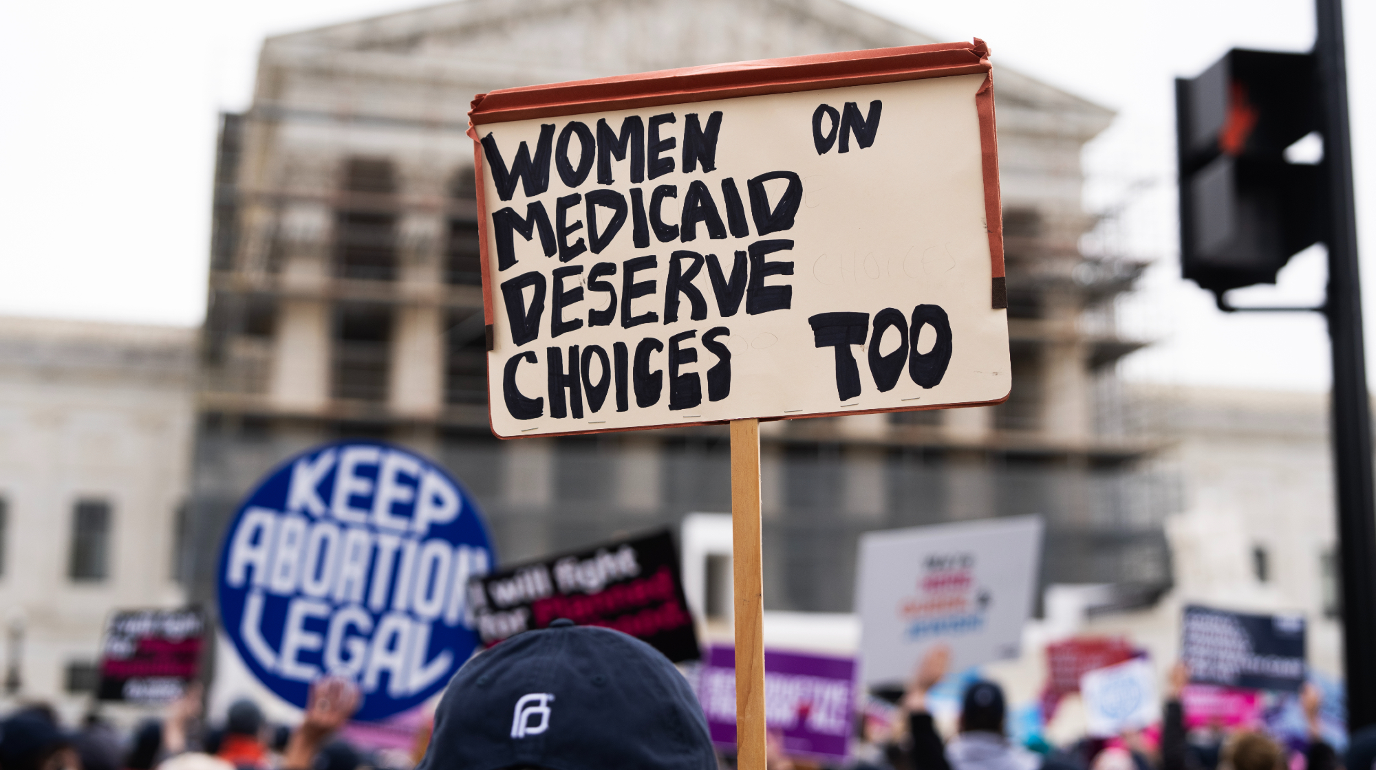 UNITED STATES - APRIL 2: A pro-choice demonstrator holds a sign in front of the U.S. Supreme Court as the Medina v. Planned Parenthood South Atlantic case is heard on Wednesday, April 2, 2025. 