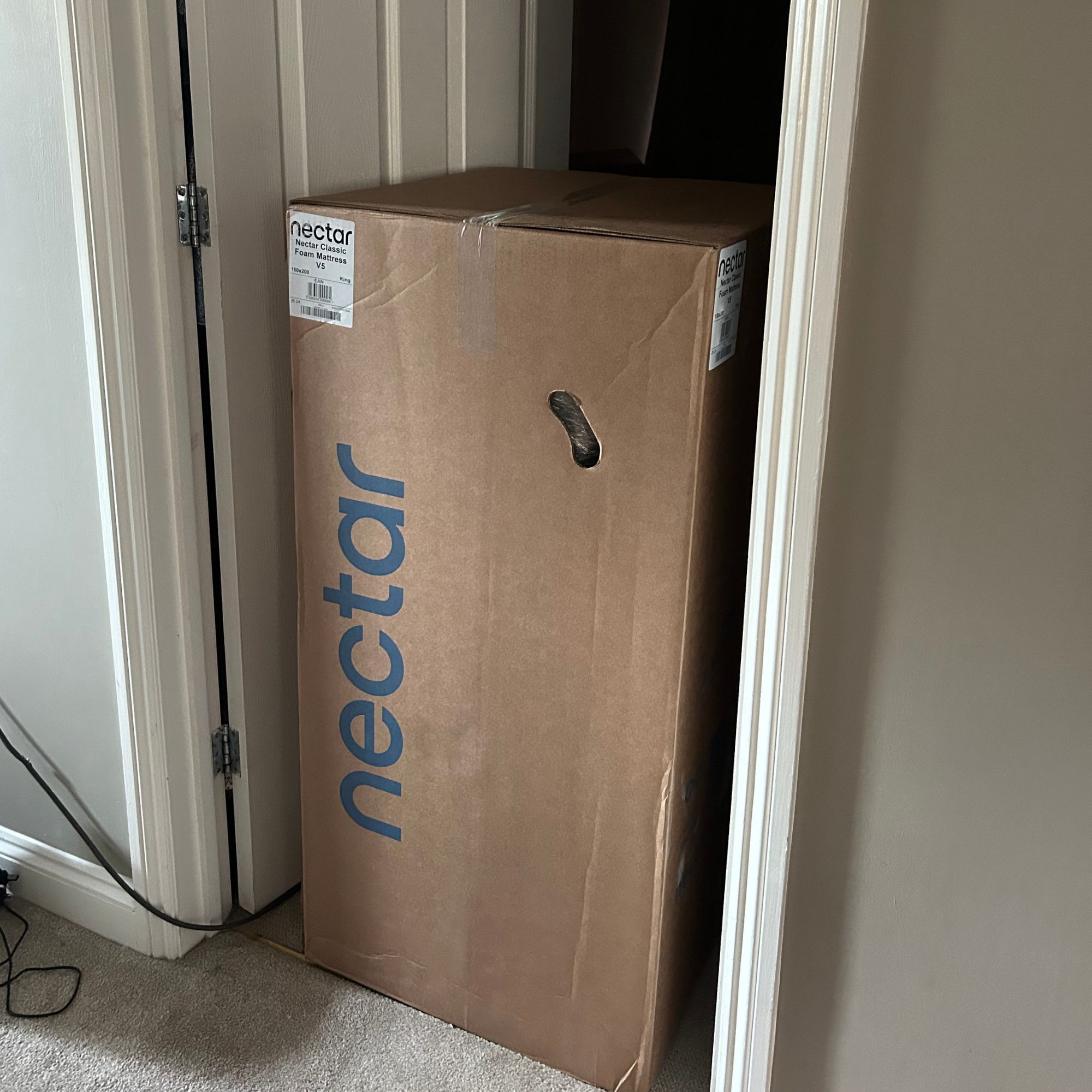 Nectar mattress in box in doorway