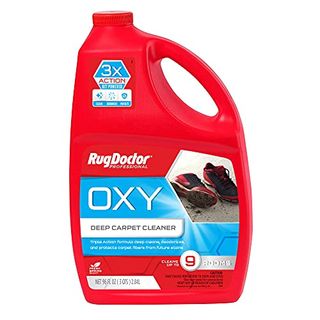 A side on view of a red bottle of Rug Doctor Triple-Action Oxy Carpet Cleaner with blue label