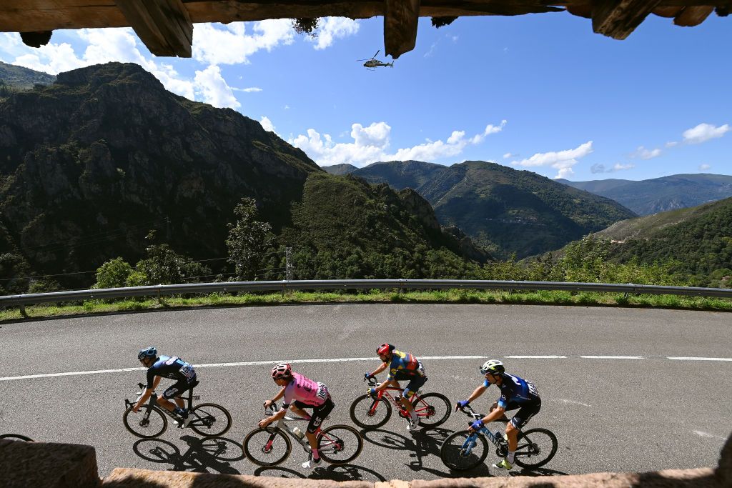 LACRUZDELINARES SPAIN SEPTEMBER 14 LR Max Poole of The United Kingdom and Team DSM firmenich Andrea Piccolo of Italy and Team EF EducationEasyPost Julien Bernard of France and Team Lidl Trek and Imanol Erviti of Spain and Movistar Team compete in the breakaway during the 78th Tour of Spain 2023 Stage 18 a 1789km stage from Pola de Allande to La Cruz de Linares 840m UCIWT on September 14 2023 in La Cruz de Linares Spain Photo by Tim de WaeleGetty Images