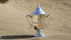 US Women's Open trophy positioned in a bunker