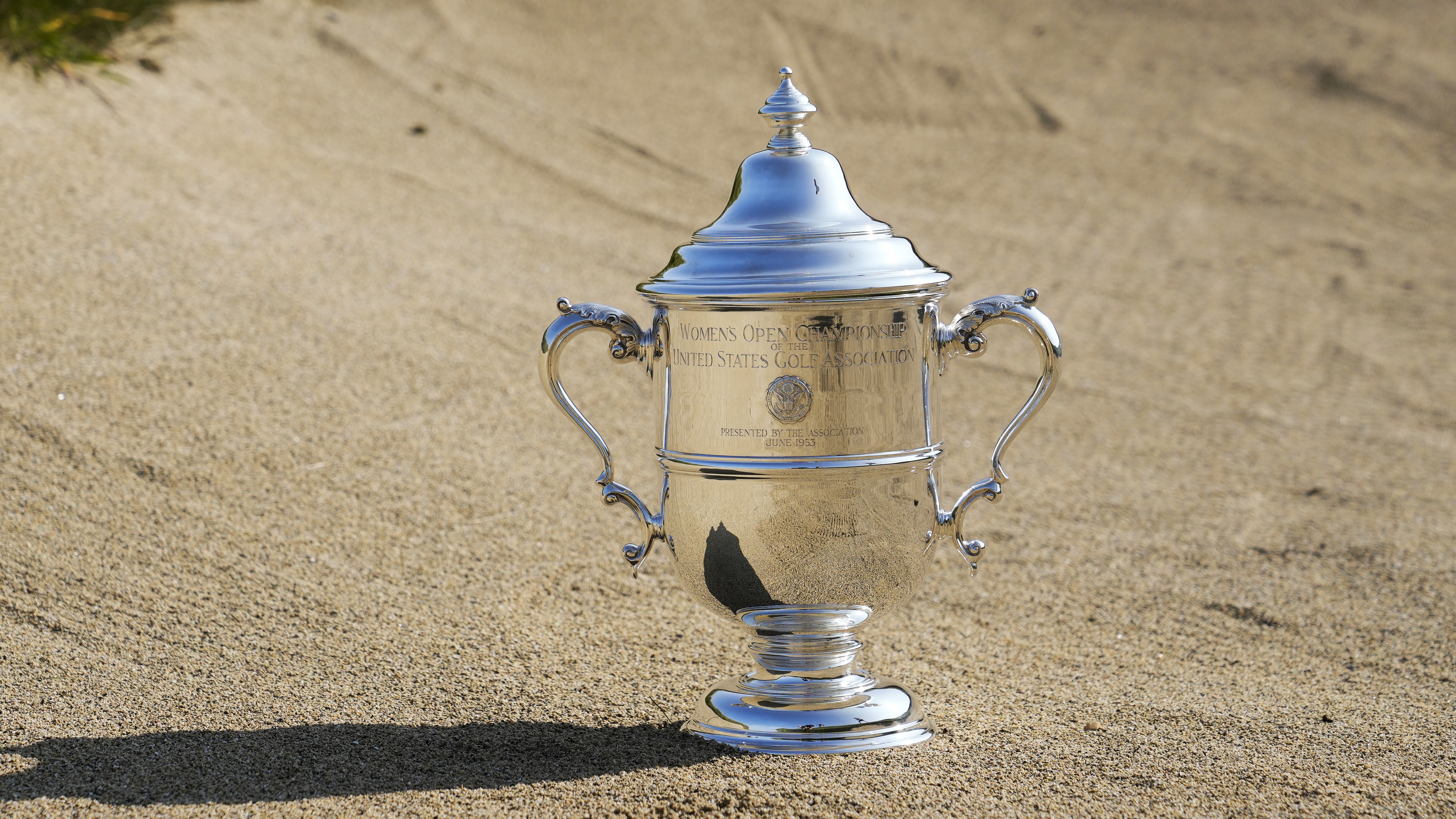 US Women's Open trophy positioned in a bunker