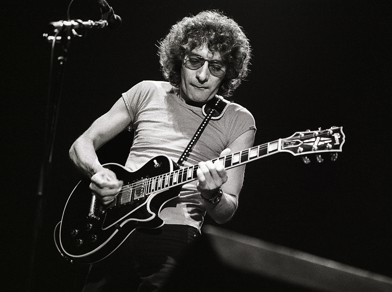 Albert Lee performs on stage with Eric Clapton at Ahoy, Rotterdam, Netherlands, 23rd April 1983. He plays a Gibson Les Paul Custom guitar.