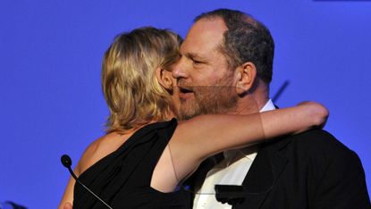 Harvey Weinstein embraces the actress Sharon Stone in 2015