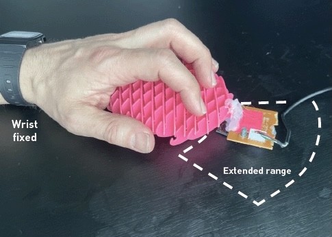 a prototype of a dome-shaped computer mouse with an extended front end