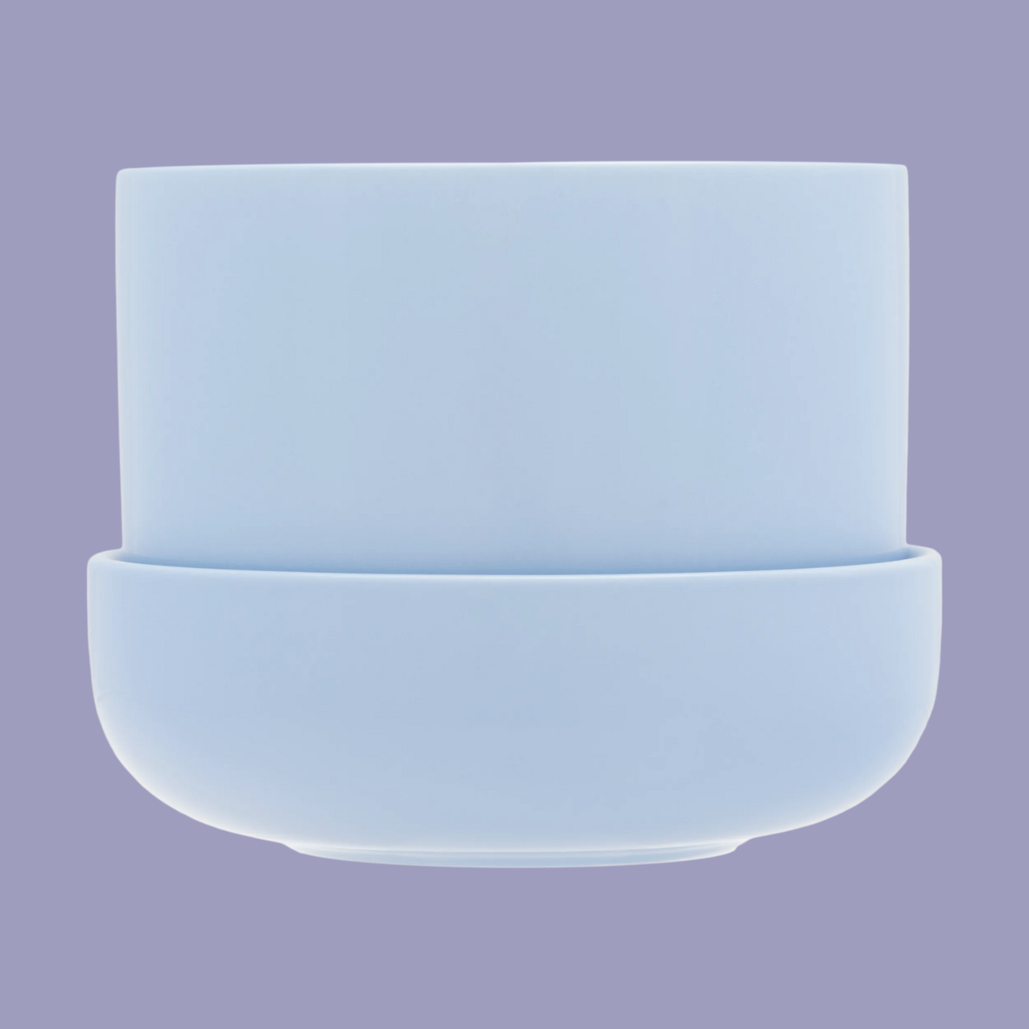A blue planter with a saucer