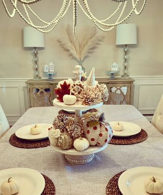 tiered dessert tray DIY Thanksgiving table decor idea with pumpkins and pinecones