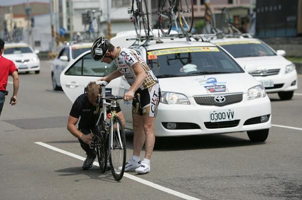 A Champion Systems team rider has a mechanical