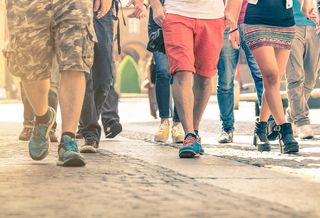 A crowd of people walking