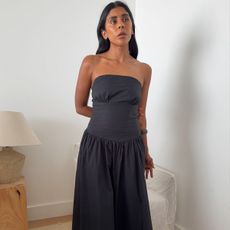 Monikh wearing black strapless dress