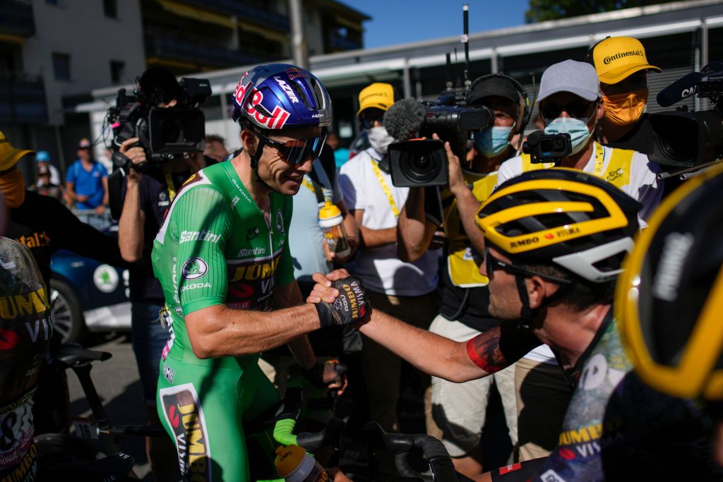 LAUSANNE SWITZERLAND JULY 09 Wout Van Aert of Belgium and Team Jumbo Visma Green Points Jersey celebrates at finish line as stage winner with his teammate Tiesj Benoot of Belgium during the 109th Tour de France 2022 Stage 8 a 1863km stage from Dole to Lausanne Cte du Stade olympique 602m TDF2022 WorldTour on July 09 2022 in Lausanne Switzerland Photo by Daniel Cole PoolGetty Images