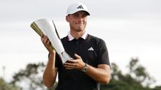 Ludvig Aberg with the Genesis Invitational trophy