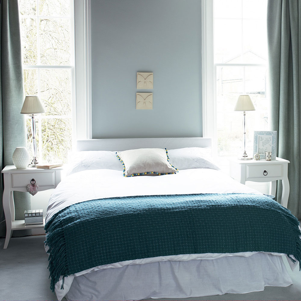 bedroom with white window bed and lamp