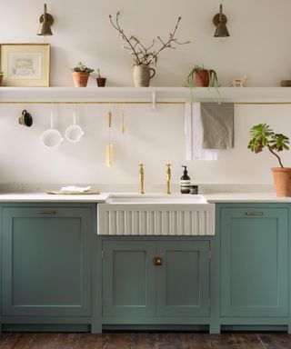 kitchen with blue cabinets and white open shelving