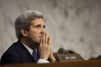 John Kerry arrives in Baghdad, urges Iraqis to form new government