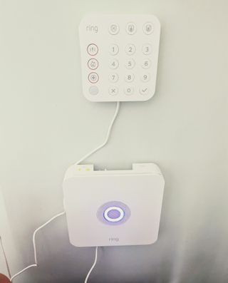 Ring Alarm Kit hub and keypad mounted to wall in writer's home