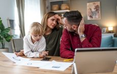 Young family with a daughter feeling distressed managing finances, paying bills and taxes