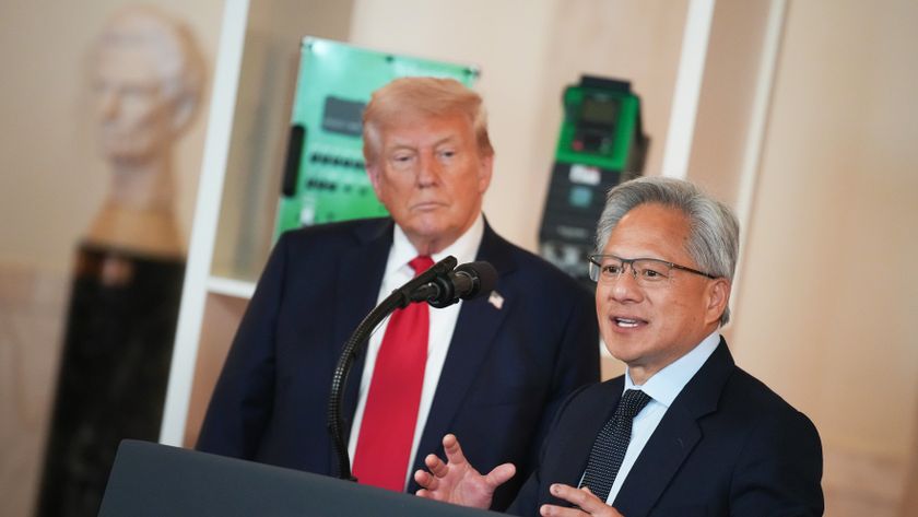 WASHINGTON, DC - APRIL 30: U.S. President Donald Trump (L) listens as Nvidia CEO Jensen Huang speaks in the Cross Hall of the White House during an event on &quot;Investing in America&quot; on April 30, 2025 in Washington, DC. Trump was joined by CEOs to highlight companies and their investments in the United States during the event. (Photo by Andrew Harnik/Getty Images)