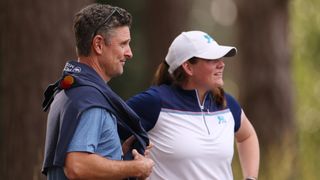 Lorna McClymont of Great Britain & Ireland looks on with Justin Rose at the Curtis Cup