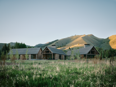 Three Barns by Field Architecture, a rural american home designed to look like a collection of old wooden barns