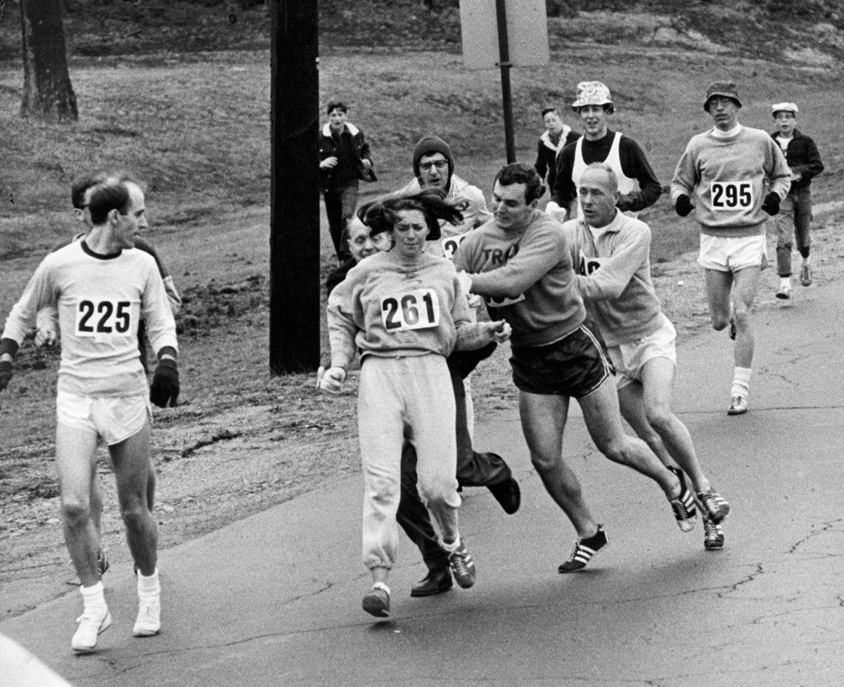 Kathrine Switzer running the Boston Marathon in 1967. At one point during the race, an official tried to push Switzer off the course.