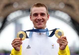 PARIS FRANCE AUGUST 03 Gold medalist Remco Evenepoel of Team Belgium poses on the podium with his gold medals of Individual Time Trial and Road Race during the Mens Road Race on day eight of the Olympic Games Paris 2024 at trocadero on August 03 2024 in Paris France Photo by Tim de WaeleGetty Images