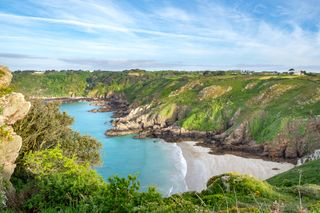 View over Petit Port Bay and the south coast cliffs of Guernsey.